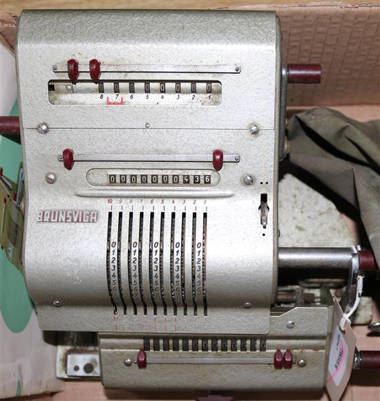 A Brunsviga 13 RK vintage calculating machine, with original cover and instruction manual